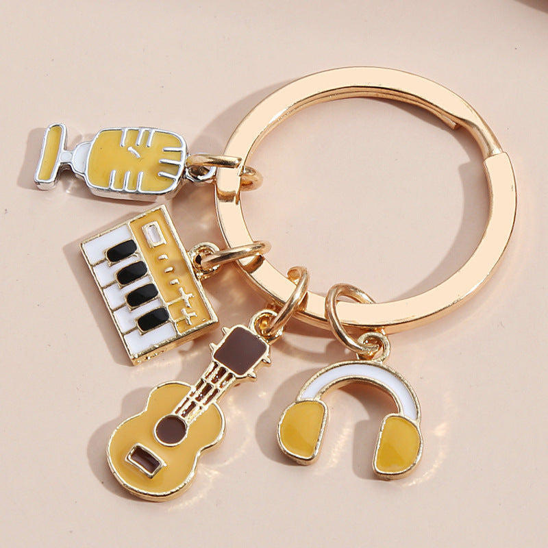 Wholesale Piano Keyboard Earphone Microphone Combination Dripping Oil Metal Keychain